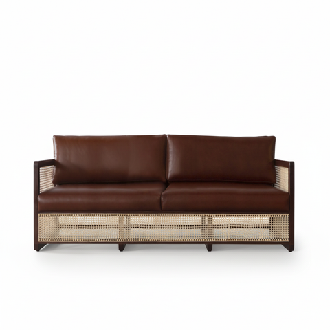The Veda rattan leather sofa front view pure white background with shadow
