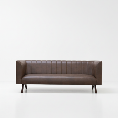 The Obsidian dark brown channel tufted leather sofa front view